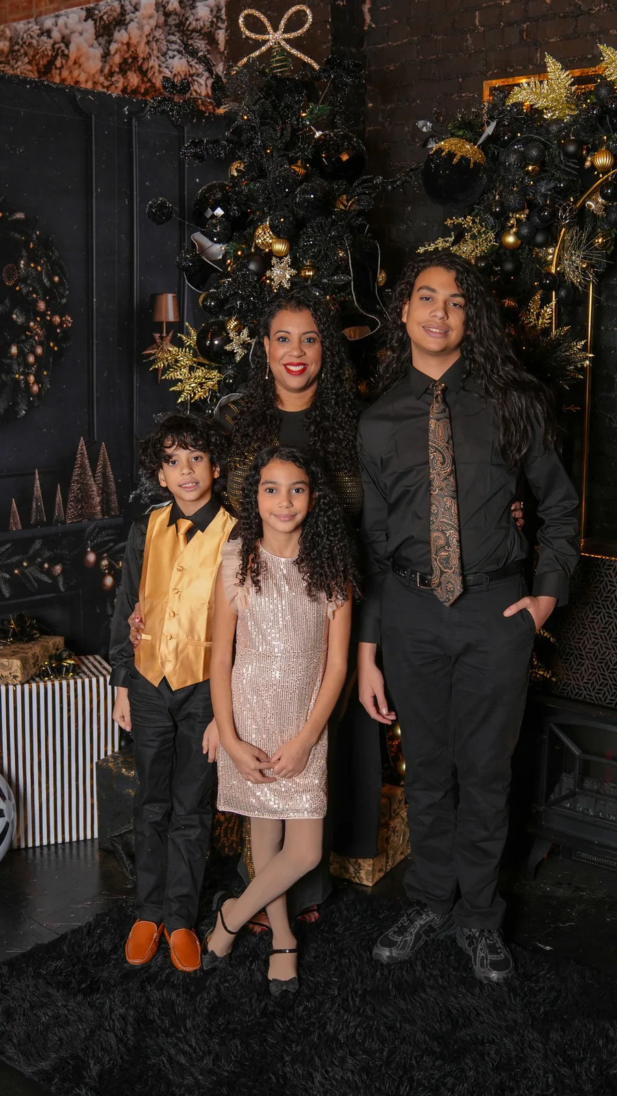 Mom with all three kids in front of the black-and-gold tree — sequins, a gold vest, and one paisley tie — Maximus Visions, New Jersey