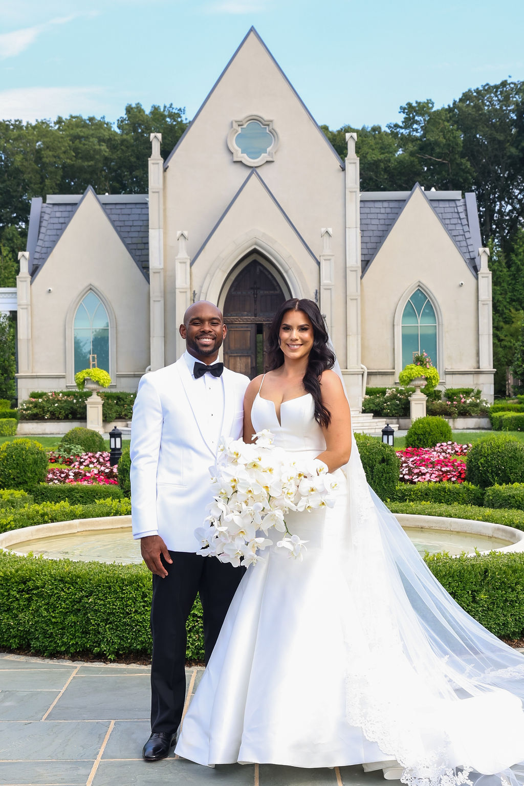 Orin and Estefania portrait outside the Gothic chapel at Park Chateau Estate after the ceremony — Maximus Visions, New Jersey