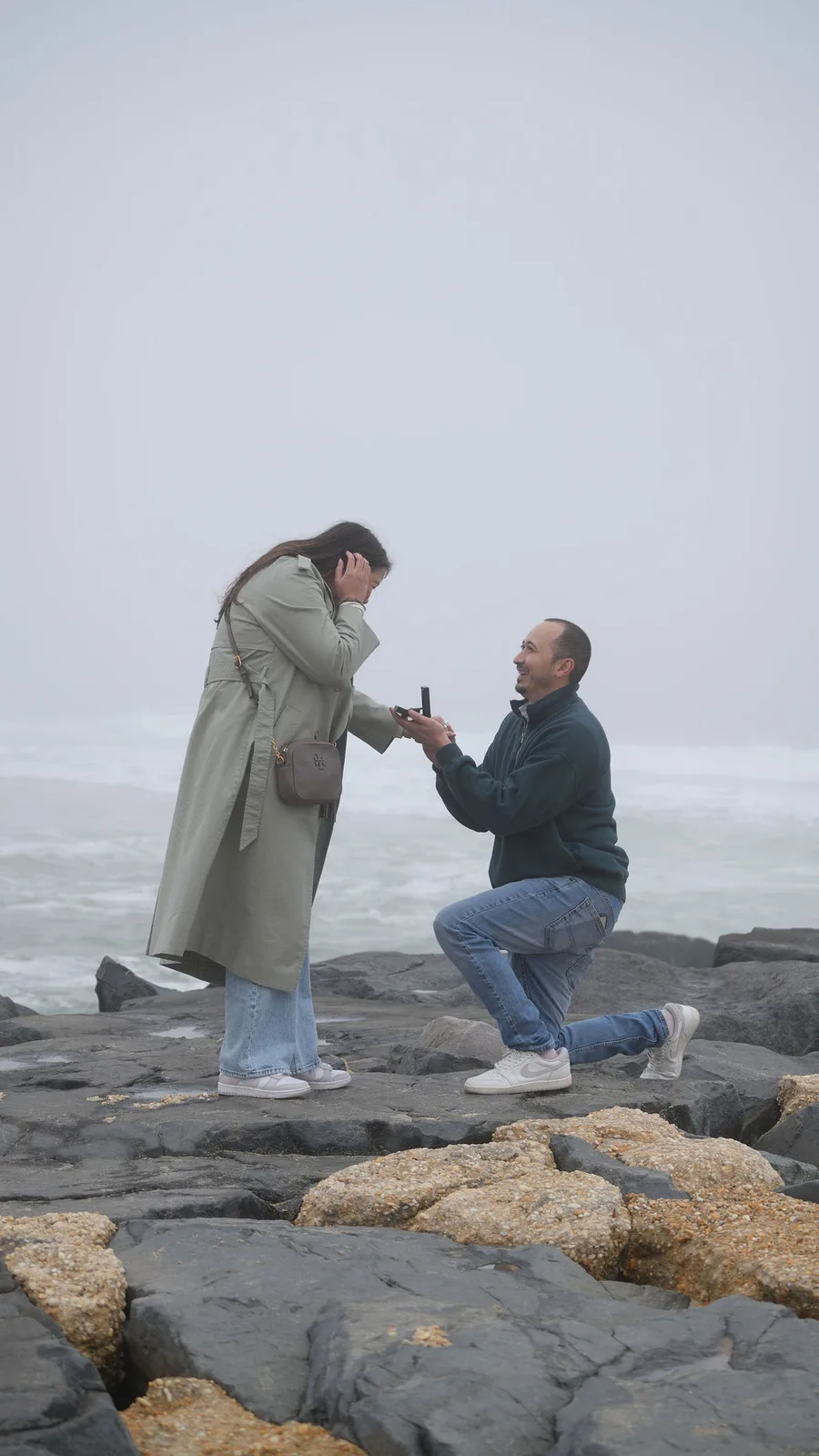 Her hands fly to her face as the question lands — documentary proposal photography by Maximus Visions, New Jersey