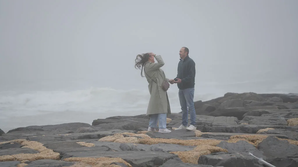She catches her breath, hand in her hair, as it all sinks in — candid just-engaged moment, New Jersey